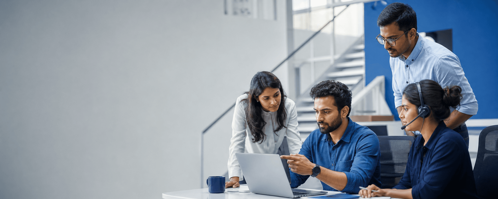 A PhonoAI conversational AI operations team collaborating in a bright studio